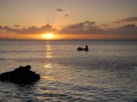 Norton in the dinghy at sunset (Hen Island)