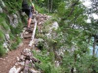 Cris climbs up through the cliffs (Slovenia)