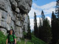 Cris walking under cliffs (Slovenia)