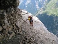 Em climbing near cliff (Triglav Nat. Park, Slovenia)