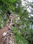 Cris climbs up through the cliffs (Slovenia) resize