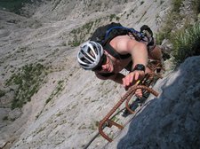 Cris reaches for ladder (Lago di Garda, Italy) resize