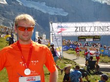 Cris with finish behind 3 (Jungfrau Marathon 2011) resize
