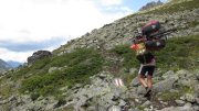 Chris carrying his bike to Grialetschhütte (Switzerland)