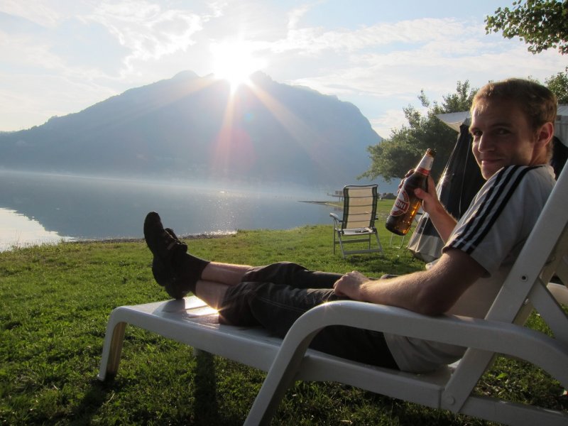 Jakob drinks beer by the lake (Lago di Lecco)