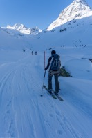 Heading off with snow stake (Ski touring Jamtalhuette)
