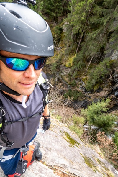 Cris on the Toblacher Wasserfall via ferrata (Multisport weekend in Austria March 2024)