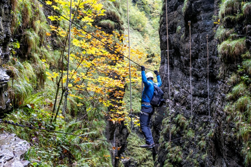 Johannes crossing a bridge (Autumn adventures Dachstein Sept 2024)