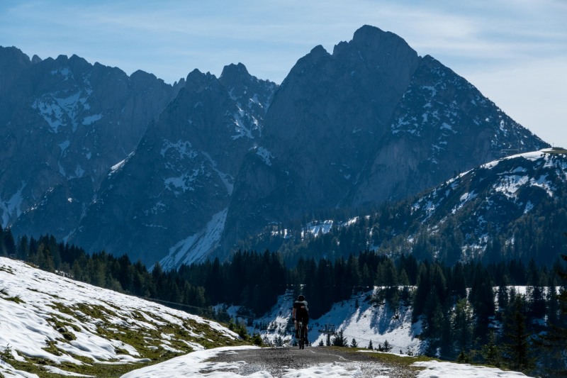 Johannes on his bike in patches of snow (Autumn adventures Dachstein Sept 2024)