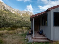 Taking off boots (Avalanche Crow Tramp April 2021)