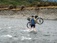 Simon carrying his bike (Bikepacking Poulter Jan 2024)