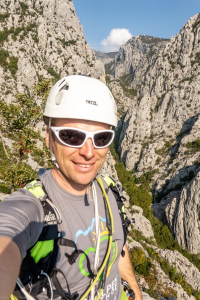 Cris with the ravine behind (Climbing Croatia Oct 2022)