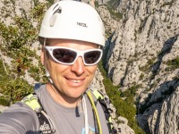 Cris with the ravine behind (Climbing Croatia Oct 2022)