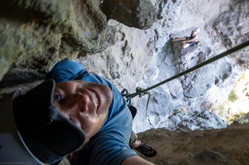 Cris climbing through the cave (Climbing Kawakawa Bay Jan 2022)
