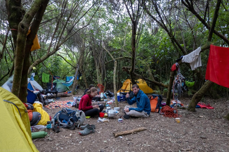 Preparing dinner at the neighbouring camp (Climbing Kawakawa Bay Jan 2022)