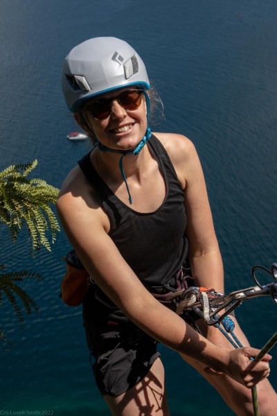 Rachel abseiling from the top of Captain Caveman (Climbing Kawakawa Bay Jan 2022)