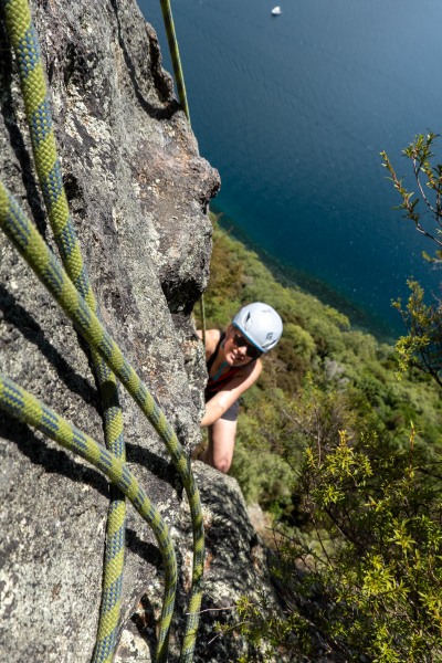 Rachel looking up on Reggae Shark (Climbing Kawakawa Bay Jan 2022)