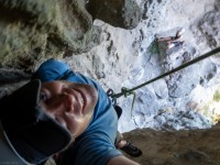 Cris climbing through the cave (Climbing Kawakawa Bay Jan 2022)