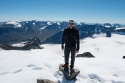 Cris and snow at the summit (Cycle Touring Norway 2016)