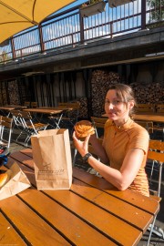 Leonie presents her baked goods (Cycle Touring Norway 2016)