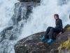 Leonie sitting by the waterfall (Cycle Touring Norway 2016)