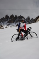 Cris gets bogged down in the snow (Cycling Dolomites)
