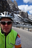 Cris riding with snowy background 2 (Cycling  Dolomites)