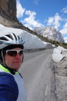 Cris with snow by the road (Cycling  Dolomites)