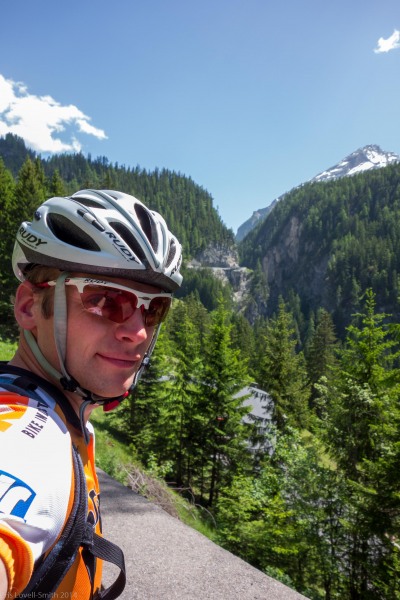 Cris and pass road behind (Cycling Switzerland June 2014)