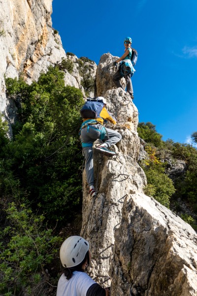 Ari on a rock spire (Ferrata Adventures Ager Oct 2025)