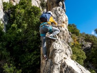 Ari on a rock spire (Ferrata Adventures Ager Oct 2025)