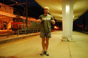 Cris rubs his nipples to encourage the train to come (Jesenice, Slovenia)