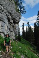 Cris walking under cliffs (Slovenia)