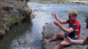 Throwing rocks into the river (30th Birthday Bash)