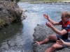 Throwing rocks into the river (30th Birthday Bash)