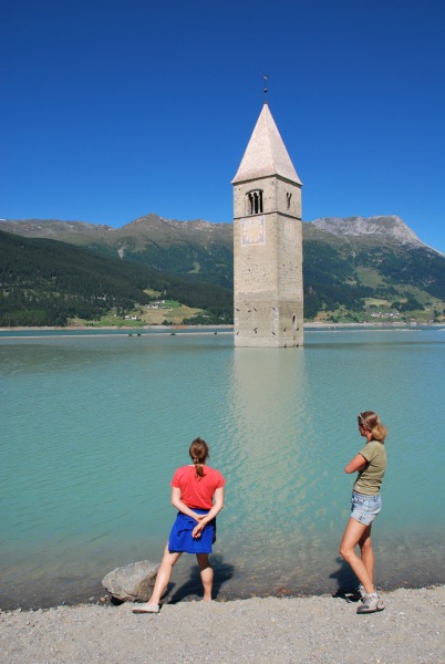 Emily and Frauke watch the church swim (Reschenpass, Italy)