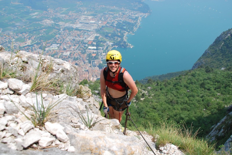 Emily on klettersteig with Riva below (Lago di Garda)