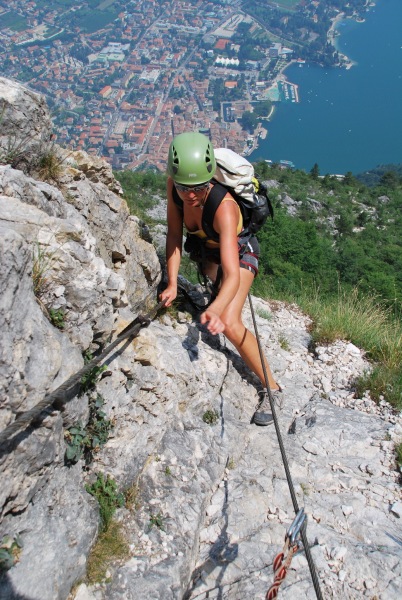 Frauke on klettersteig with Riva below (Lago di Garda)