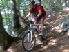 Chris descending through forest (Lago di Garda, Italy)