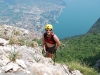Emily on klettersteig with Riva below (Lago di Garda)