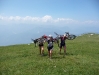 Frauke, Emily, and Cris carrying there bikes to the top of Monte Stivo (Lago di Garda, Italy)
