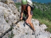 Frauke on klettersteig with Riva below (Lago di Garda)