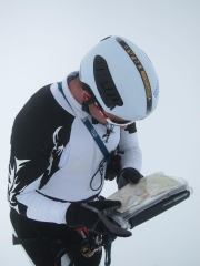 Chris reading the map in white out (Langdalstindane, Norway)