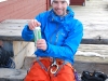 Aly opens a beer (Lyngen Alps, Norway)