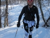 Chris skinning through the trees (Daltinden, Norway)