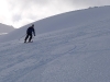 Cris skiing down (Rørnestinden, Norway)