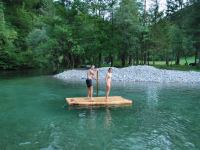 Chris + Em on a raft at the swimming hole (OO.cup, Slovenia)