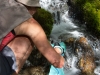Leonie filling her water bladder (Rabbit Pass Tramp Dec 2014)