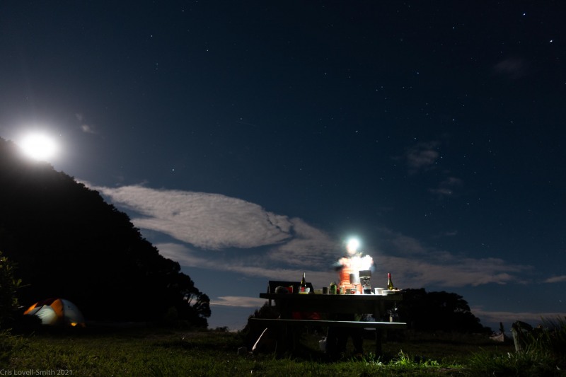 Ellen at the picnic table in the evening (Seakayaking Abel Tasman April 2021)