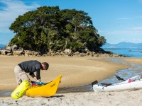 Craig unloading a kayak (Seakayaking Abel Tasman April 2021)